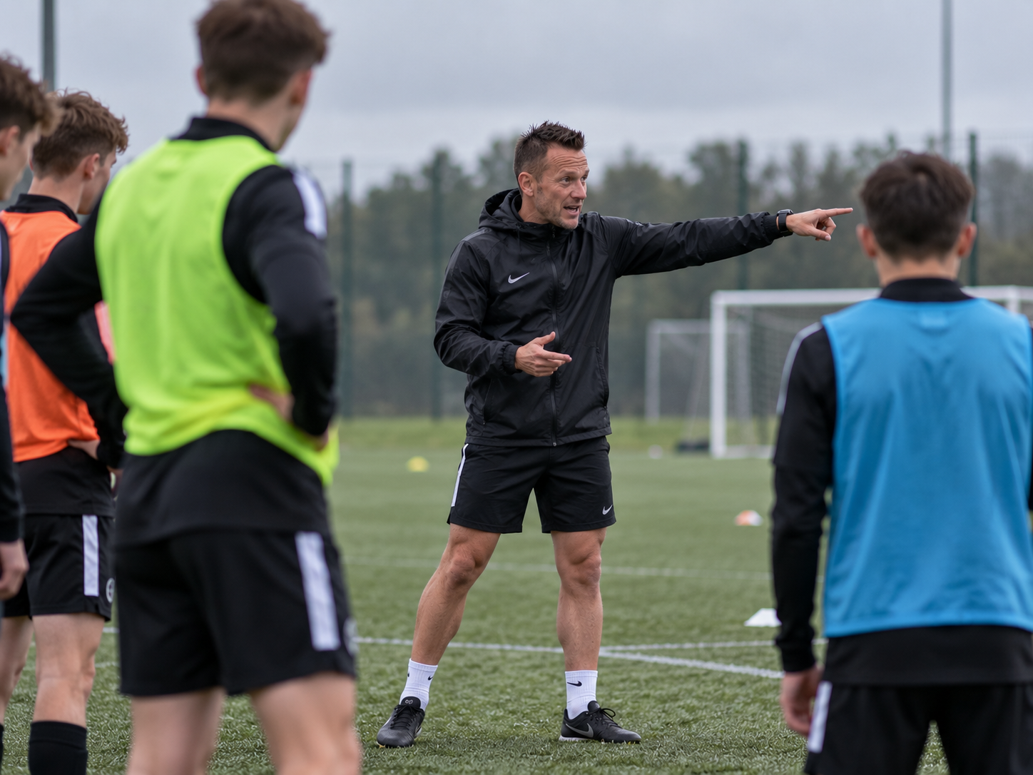 John Chisholm coaching players during an on-pitch football session
